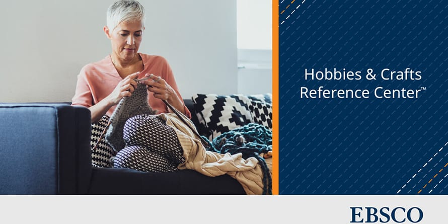 A woman knitting on a couch surrounded by cozy blankets